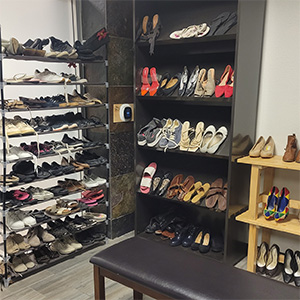 Shelves filled with shoes and clothing at the free Clothing Boutique at Desert Vineyard Church, Lancaster, CA.