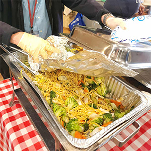 Hot, home-cooked meal being served at Monday Manna at Desert Vineyard Church, Lancaster, CA.